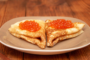 Russian pancakes with red caviar