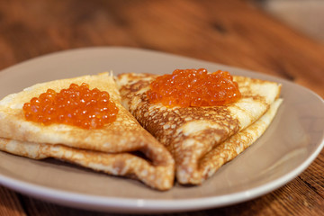 Russian pancakes with red caviar