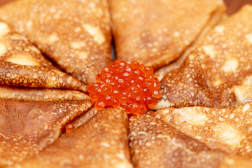 Russian pancakes with red caviar