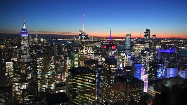 NEW YORK CITY - DECEMBER 4, 2018: Sunset aerial view of Manhattan skyline from a rooftop. New York attracts 50 million people annually