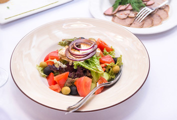 vegetable salad, Greek salad on a white plate on  dining table
