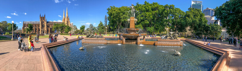 SYDNEY, AUSTRALIA - AUGUST 19, 2018: Locals and tourists enjoy Archibald Fountain in Hyde Park. This is a major destination in Sydney