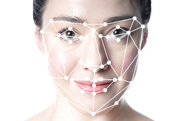 face detection or facial recognition grid overlay on face of young beautiful woman - artificial...