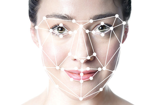 face detection or facial recognition grid overlay on face of young beautiful woman - artificial intelligence or identity or technology concept