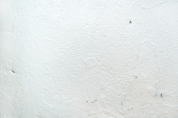 Grungy white concrete wall background. Background from high detailed fragment stone wall. Cement texture.