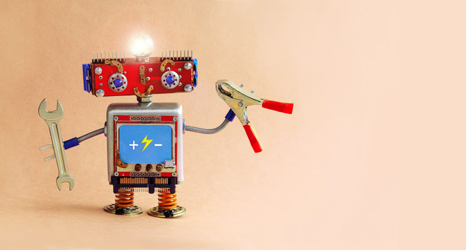 Electrician robot with hand wrench and pliers. Futuristic toy robot handyman with a glowing lamp. copy space