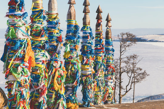 Traditional buryat shaman sacred poles during the winter, cape Burkhan, Olkhon island, Baikal lake in Russia