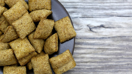 crackers on a plate on a wooden background	