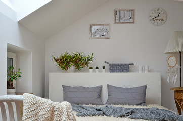 White scandinavian bedroom with double bed