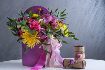 bouqet of flowers in violet box. Nice celebration present. Selective focus, close up