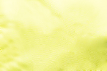 Fototapeta na wymiar Close-up of textured fabric cloth textile background yellow
