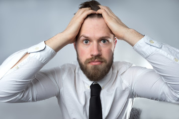 Portrait of the scared and unhappy man.