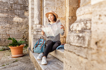 Asian traveler girl with map