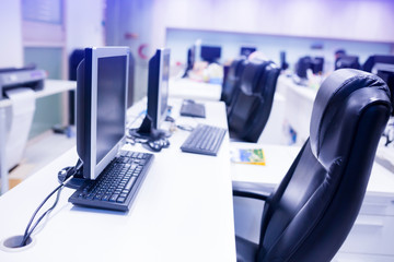 composite image of computer in office or training room