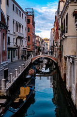 Fototapeta na wymiar View of the Venice Canal with boats and gondolas