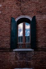 Old Window in a red brick wall