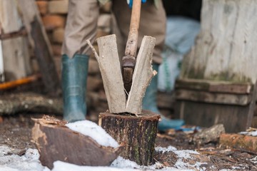 firewood cutting with axe