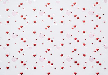 Abstract valentine's day background with red heart symbols on white background