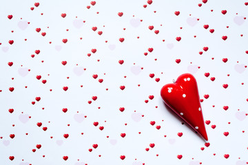 Abstract valentine's day background with red heart symbols on white background