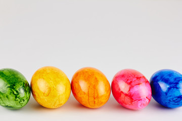 Colored Easter eggs on white background