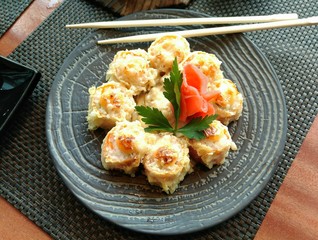 pan-Asian rolls on a blue plate on the table