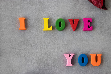 Multicolored letters on gray background. I love you. Valentine's Day Concept.