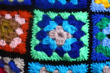 Multicolored handmade plaid of crochet made of granny squares