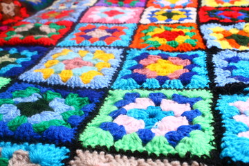 Multicolored handmade plaid of crochet made of granny squares