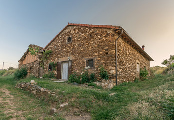 Fototapeta na wymiar Stone houses in El Negredo in the Riaza region, province of Segovia (Spain)