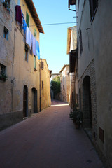 Cosy street in medieval town San Gimignano, Tuscany, Italy