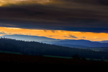 Beautiful autumn evening on the view point above the deep forest valley.