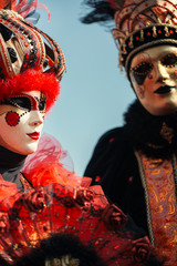 Couple in Venetian carnival costumes and masks