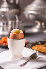 Breakfast with croutons, poached egg and coffee. Vintage dishes.