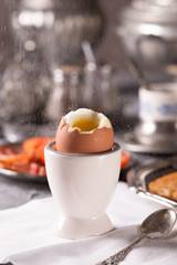 Breakfast with croutons, poached egg and coffee. Vintage dishes.