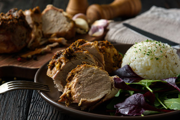 Roasted pork tenderloin served with boiled rice and mix of salad.