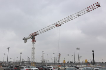Fototapeta na wymiar cranes on construction site snowy day
