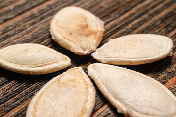 Roasted and salted pumpkin seeds in the form of flower. Close up, macro photos.