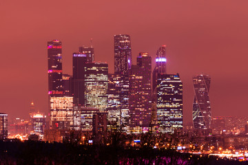 The panorama of Moscow, Russia with Moskva city skyscrapers in the winter cloudy night. The view from the observation platform of Sparrow Hills 