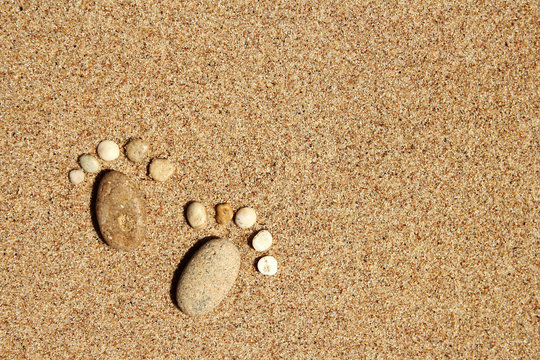 Feet of a family of stones on the sea