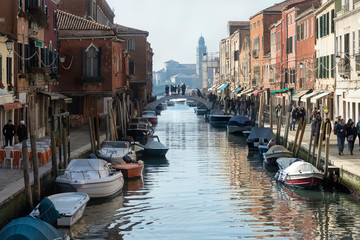 Fototapeta na wymiar The Venetian landscape. Boats in canal
