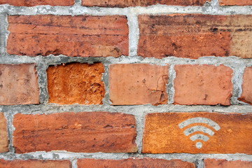 Wi-Fi icon on red brick wall