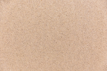 Pressed chipboard with grainy texture