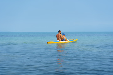 father and son in kayak