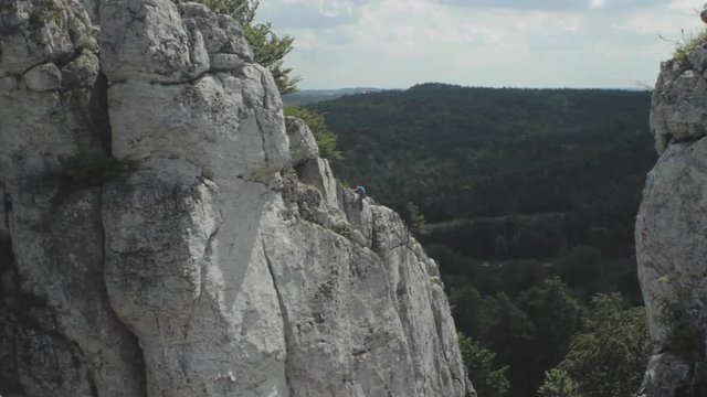View of mountain with climber in sunny day