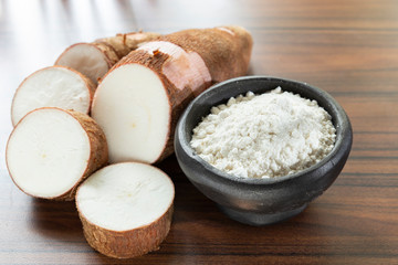Raw yucca starch on the wooden table - Manihot esculenta.