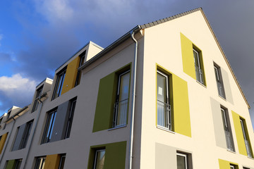 Fototapeta na wymiar Apartment building with modern facade painting