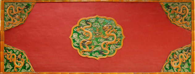 A wall relief with dragons in the Forbidden City, the former palace of the Chinese Emperor. Beijing, China