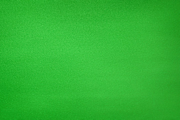 Abstract green glittered foil texture and background