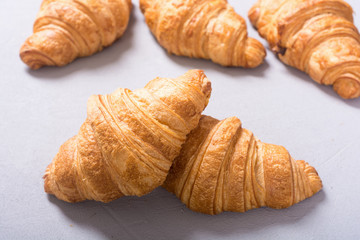 Croissants on wooden background