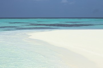 Beach of a desert island (Ari Atoll, Maldives)